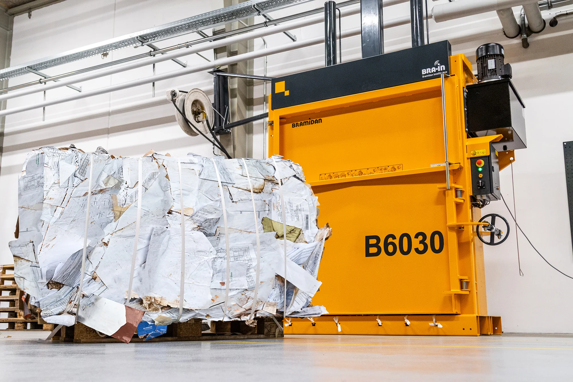 B6030 baler with paper bale in front