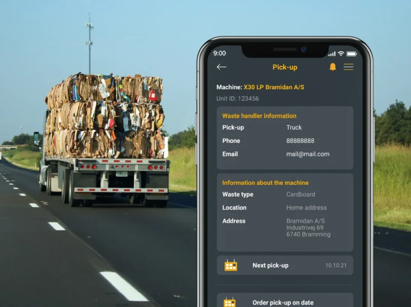 Truck with cardboard bales on highway with phone with BRA-IN App pickup in the front