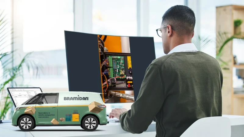 Man sitting in front of computer screen and working