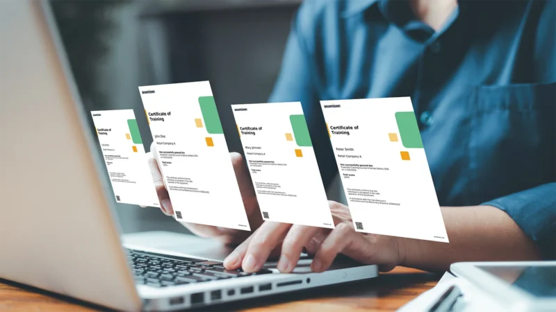 Man sitting at laptop with his screen shown as floating certifications in front.